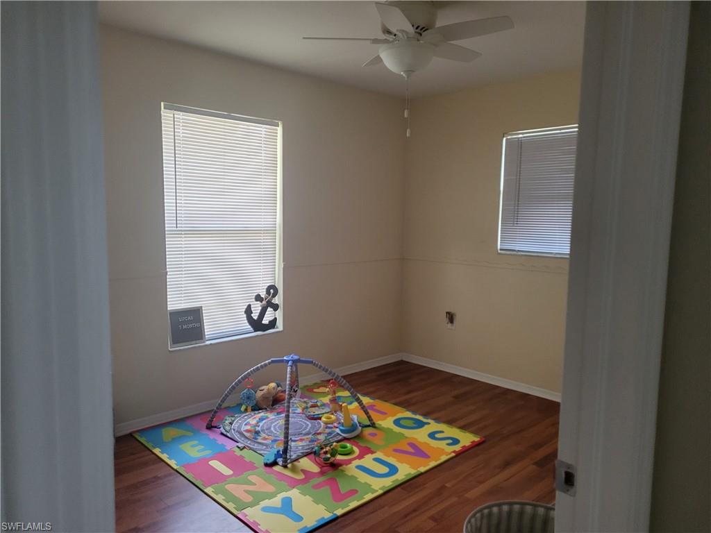 8518 Morris Road Fort Myers, FL 33967 - Photo 13 of 18 a room with toys and wooden floor