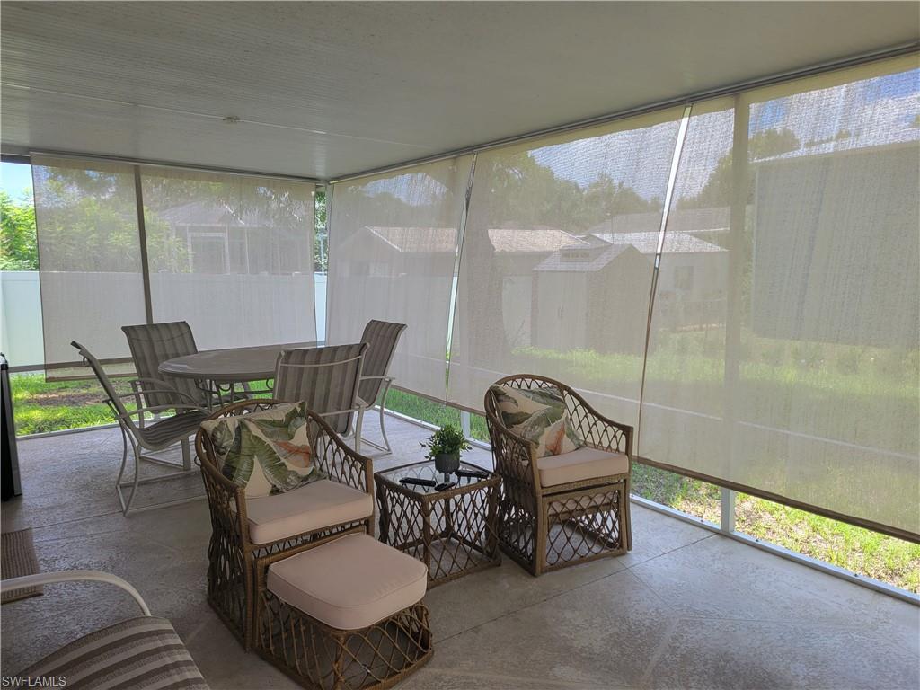 8518 Morris Road Fort Myers, FL 33967 - Photo 17 of 18 a view of a porch with furniture and a yard