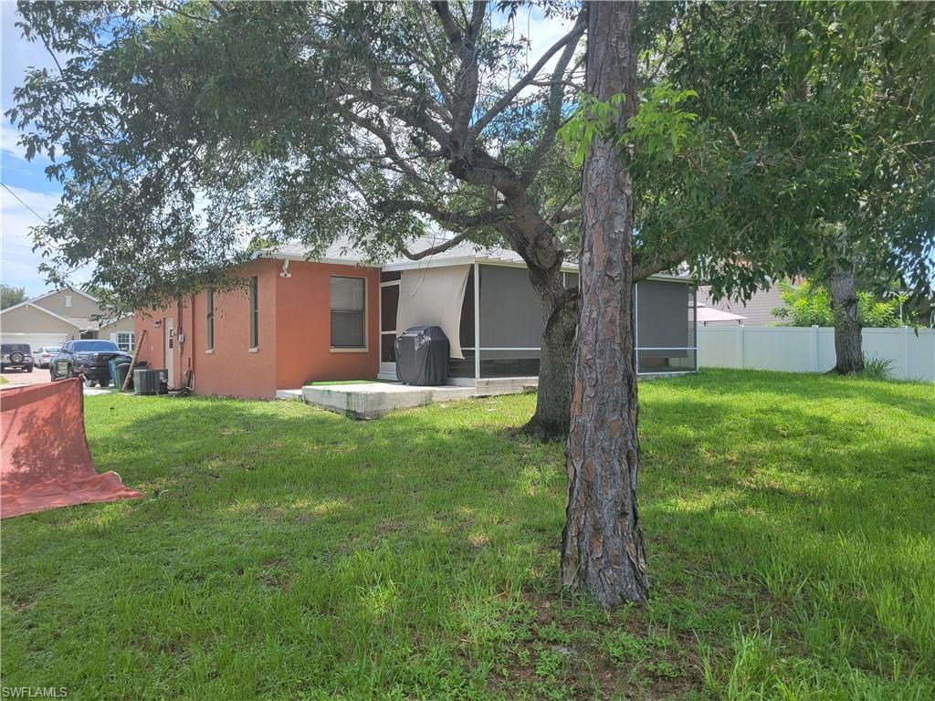 8518 Morris Road Fort Myers, FL 33967 - Photo 3 of 18 a front view of house with yard and green space