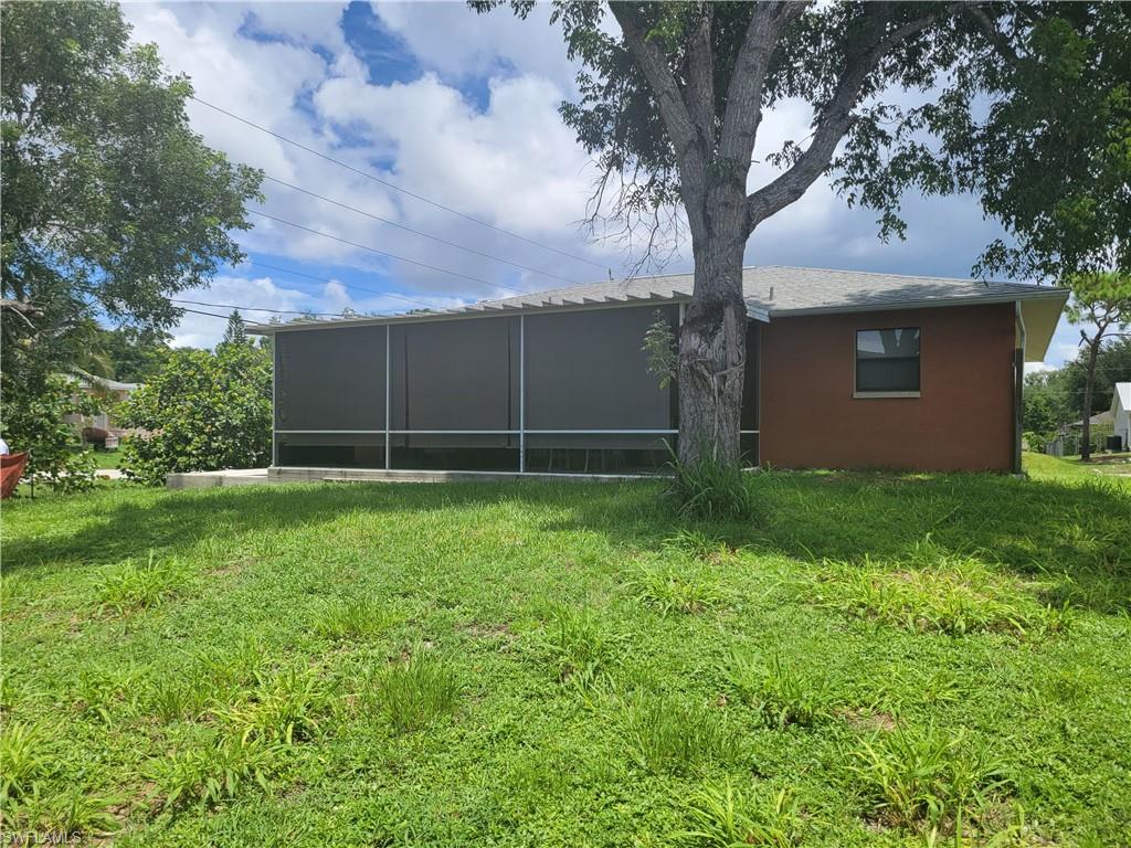 8518 Morris Road Fort Myers, FL 33967 - Photo 5 of 18 a view of a backyard with large trees