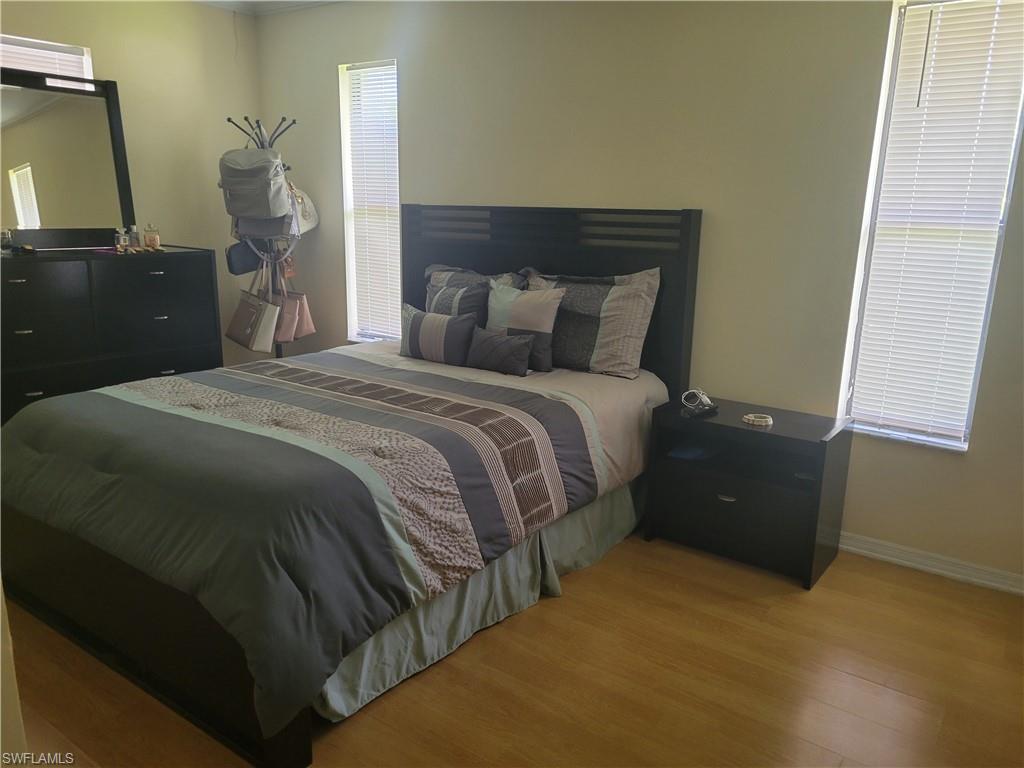 8518 Morris Road Fort Myers, FL 33967 - Photo 6 of 18 a large bed sitting in a bedroom next to a window