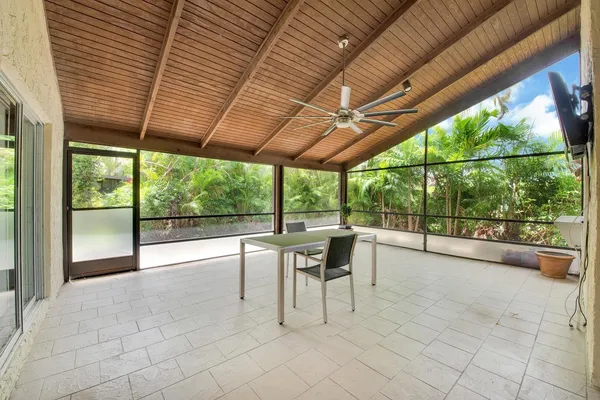 a view of a patio with a backyard