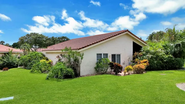 a front view of house with garden