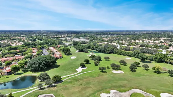 an aerial view of a houses with outdoor space
