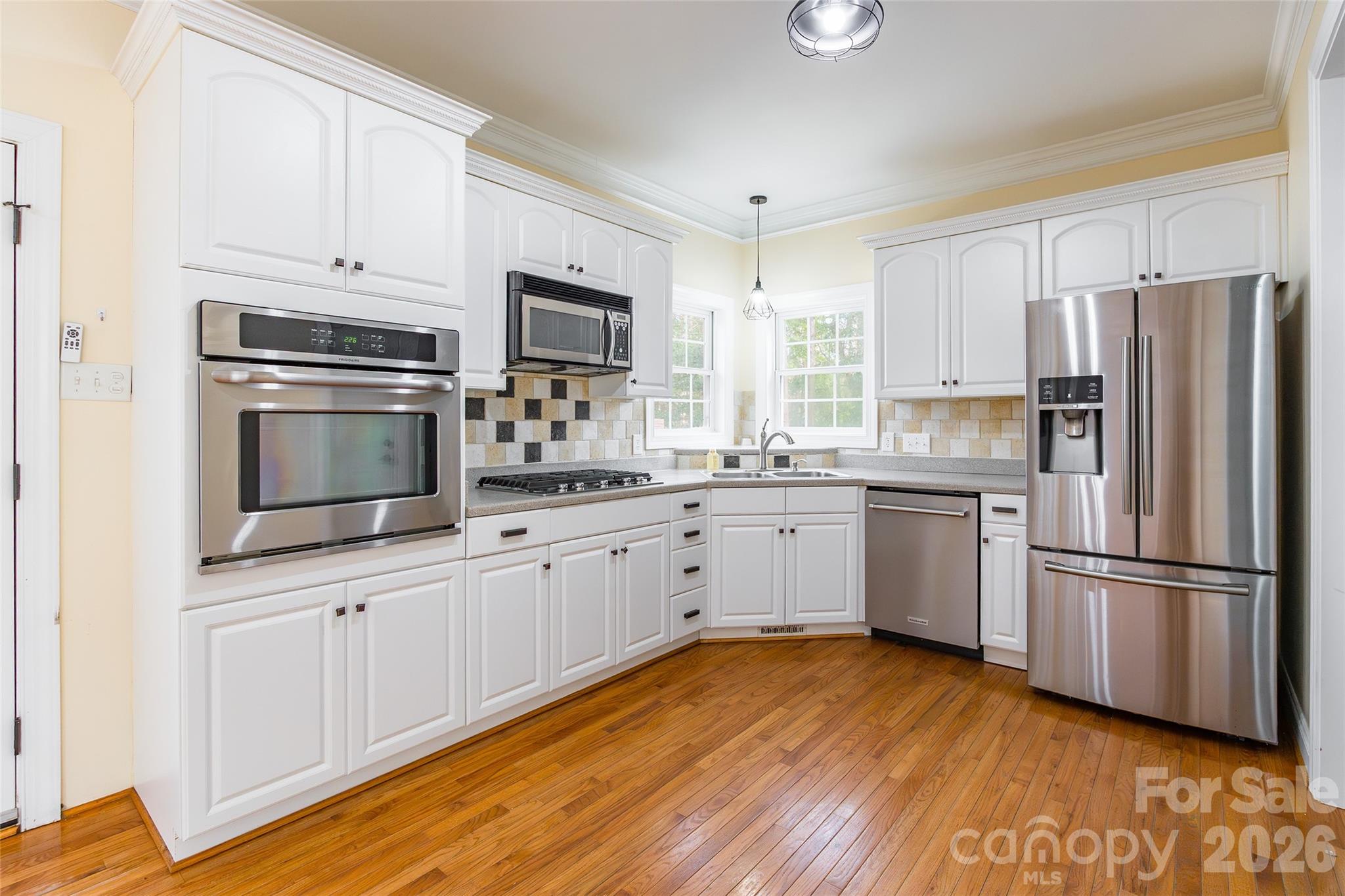 321 Forbes Court Clover, SC 29710 - Photo 8 of 31 a kitchen with appliances a sink cabinets and a window