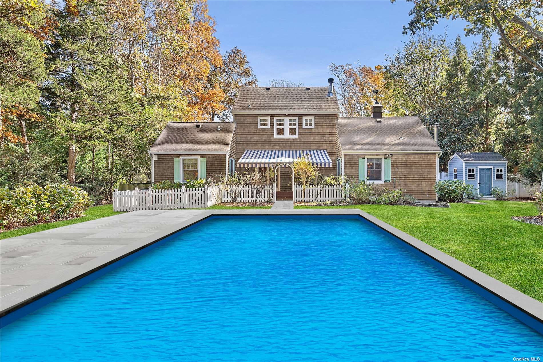 a view of a house with a swimming pool with a yard