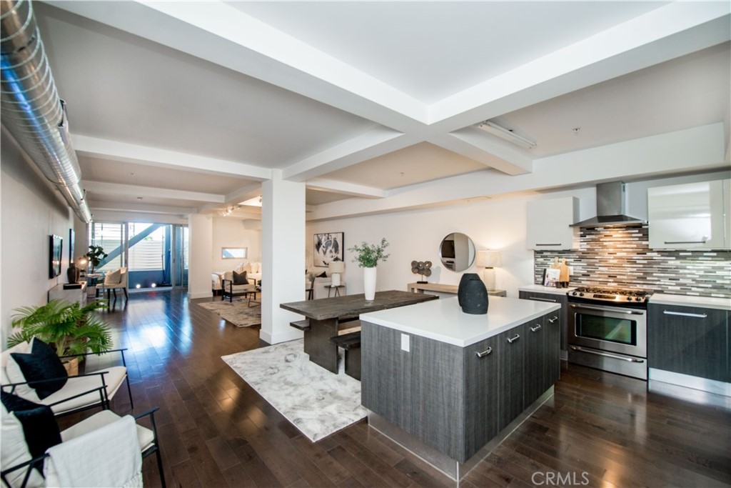 a kitchen with sink stove and cabinets