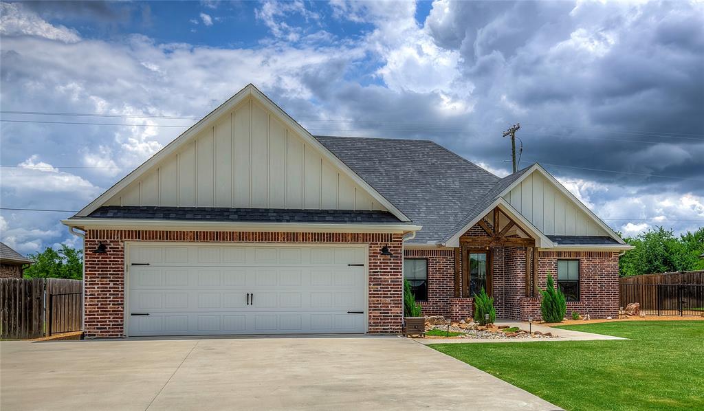 326 Koby Circle Sulphur Springs, TX 75482 - Photo 2 of 38 Professional landscaping, wrought iron and privacy-wood fencing and a 2-car garage welcome you home