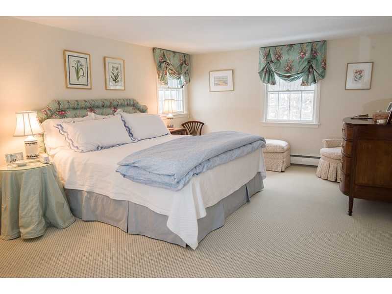 201 Michigan Road New Canaan, CT 06840 - Photo 14 of 25 a living room with a bed furniture and a window