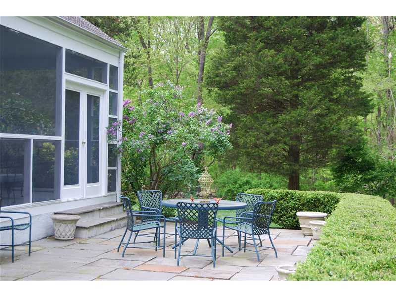 201 Michigan Road New Canaan, CT 06840 - Photo 23 of 25 a view of a patio with table and chairs and potted plants