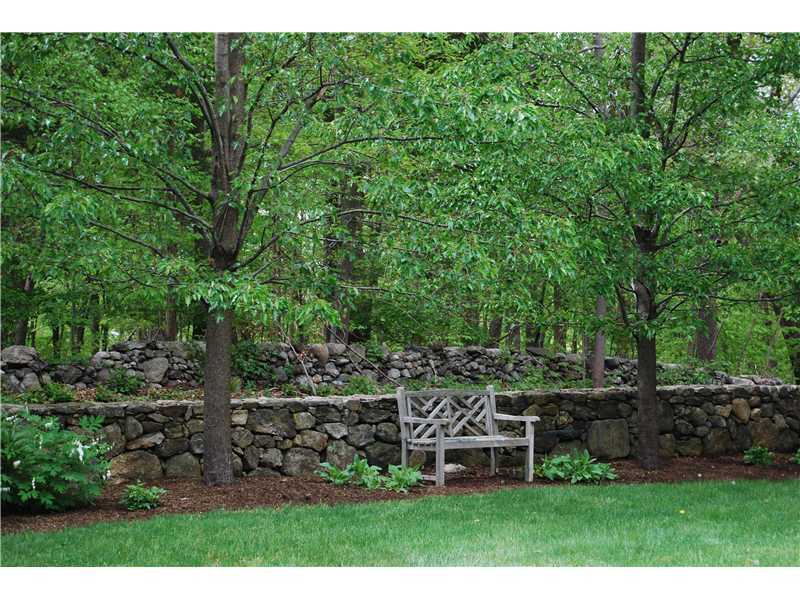 201 Michigan Road New Canaan, CT 06840 - Photo 24 of 25 a view of a chair and table and chairs in the garden