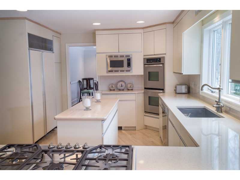201 Michigan Road New Canaan, CT 06840 - Photo 8 of 25 a kitchen with a sink stove and refrigerator