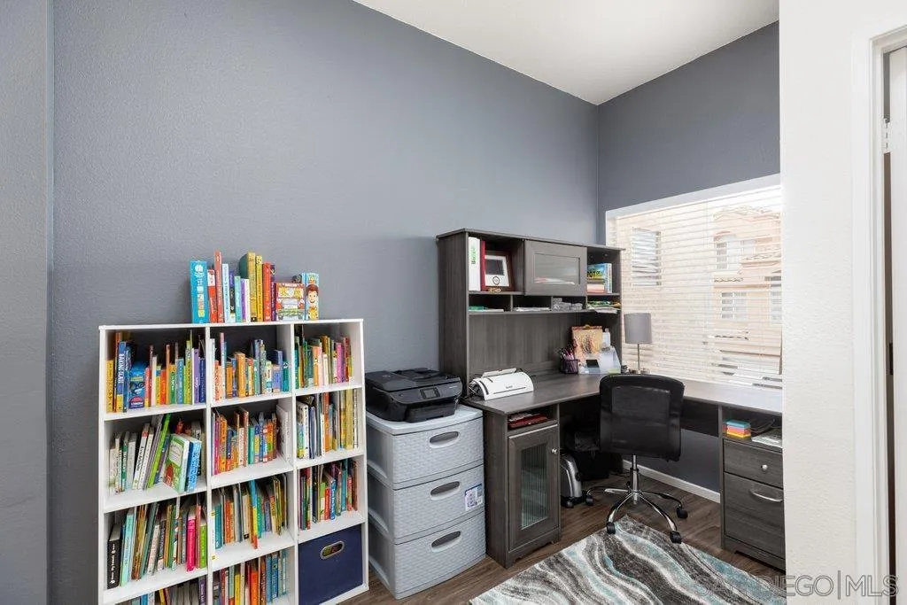 1352 Serena Circle, Unit 2 Chula Vista, CA 91910 - Photo 14 of 22 a room with a book shelf and a window