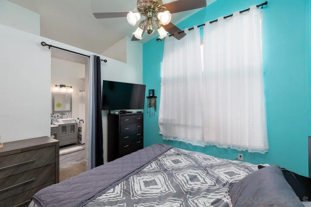 1352 Serena Circle, Unit 2 Chula Vista, CA 91910 - Photo 16 of 22 a bedroom with a bed and a television