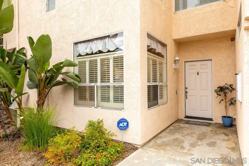 1352 Serena Circle, Unit 2 Chula Vista, CA 91910 - Photo 2 of 22 a front view of a house with garden