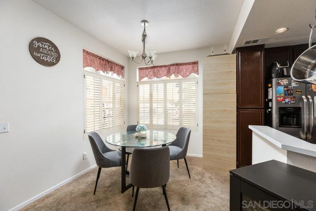 1352 Serena Circle, Unit 2 Chula Vista, CA 91910 - Photo 4 of 22 a view of a dining room with furniture window and outside view