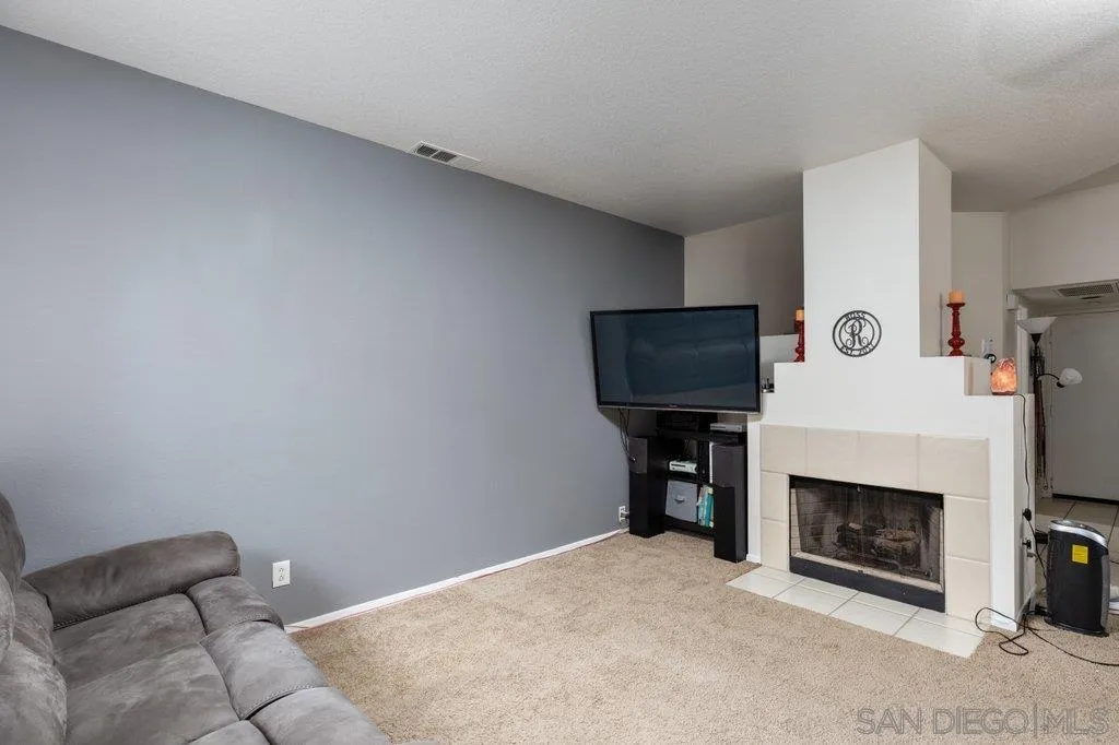 1352 Serena Circle, Unit 2 Chula Vista, CA 91910 - Photo 10 of 22 a living room with furniture and a fireplace