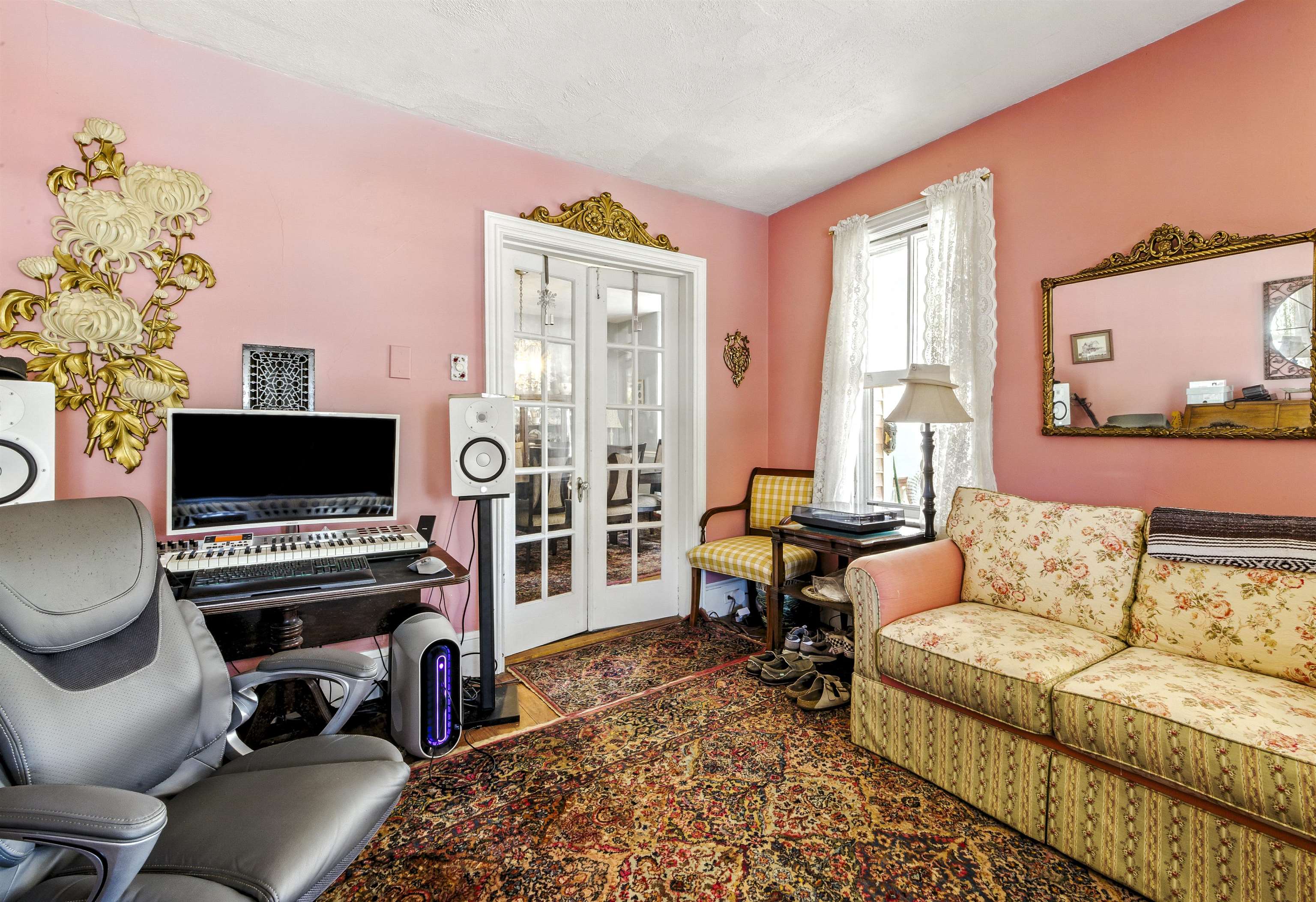 35 1st Cape May, NJ 08204 - Photo 11 of 49 a living room with furniture a flat screen tv and a fireplace
