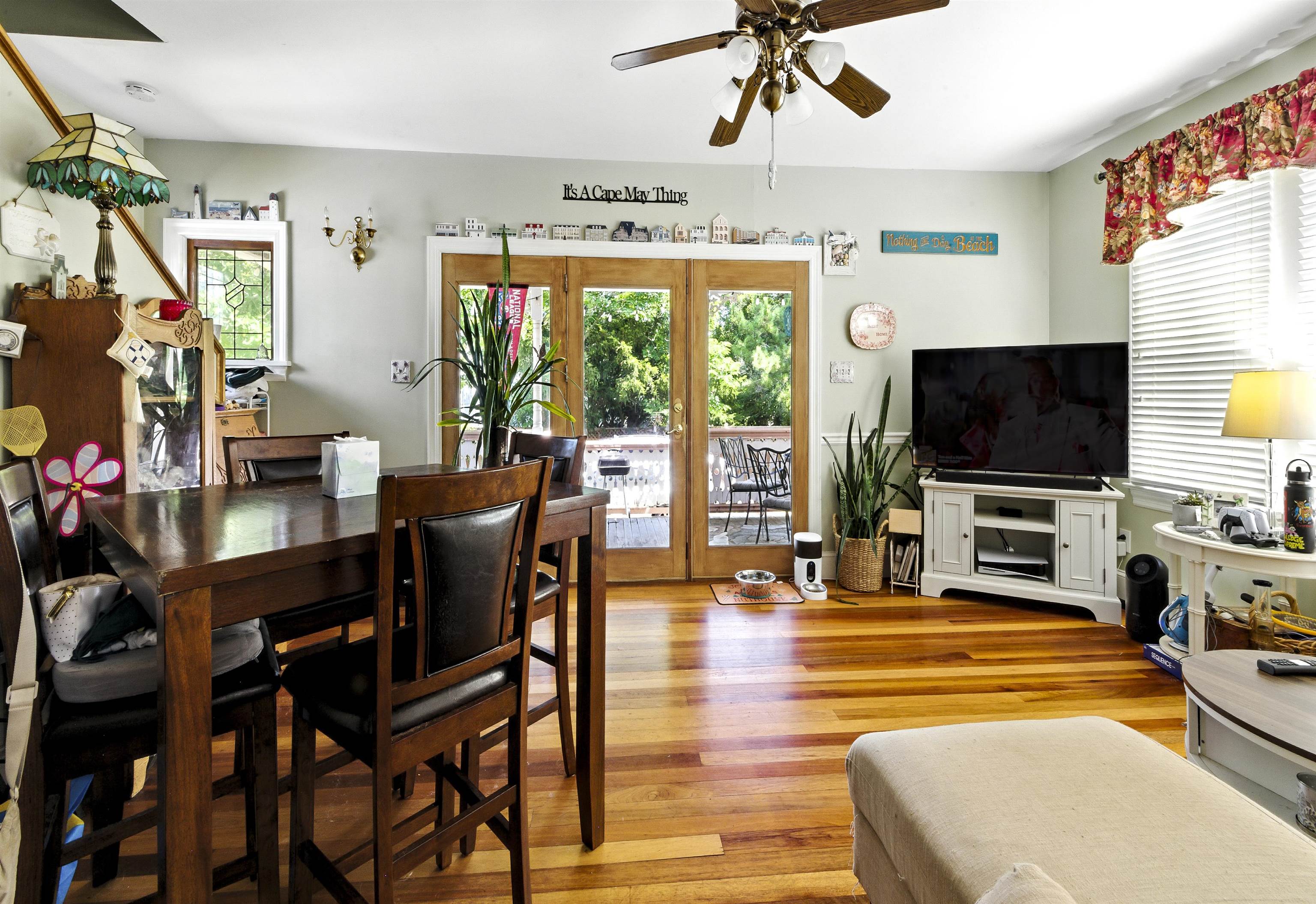 35 1st Cape May, NJ 08204 - Photo 16 of 49 a living room with furniture and a flat screen tv