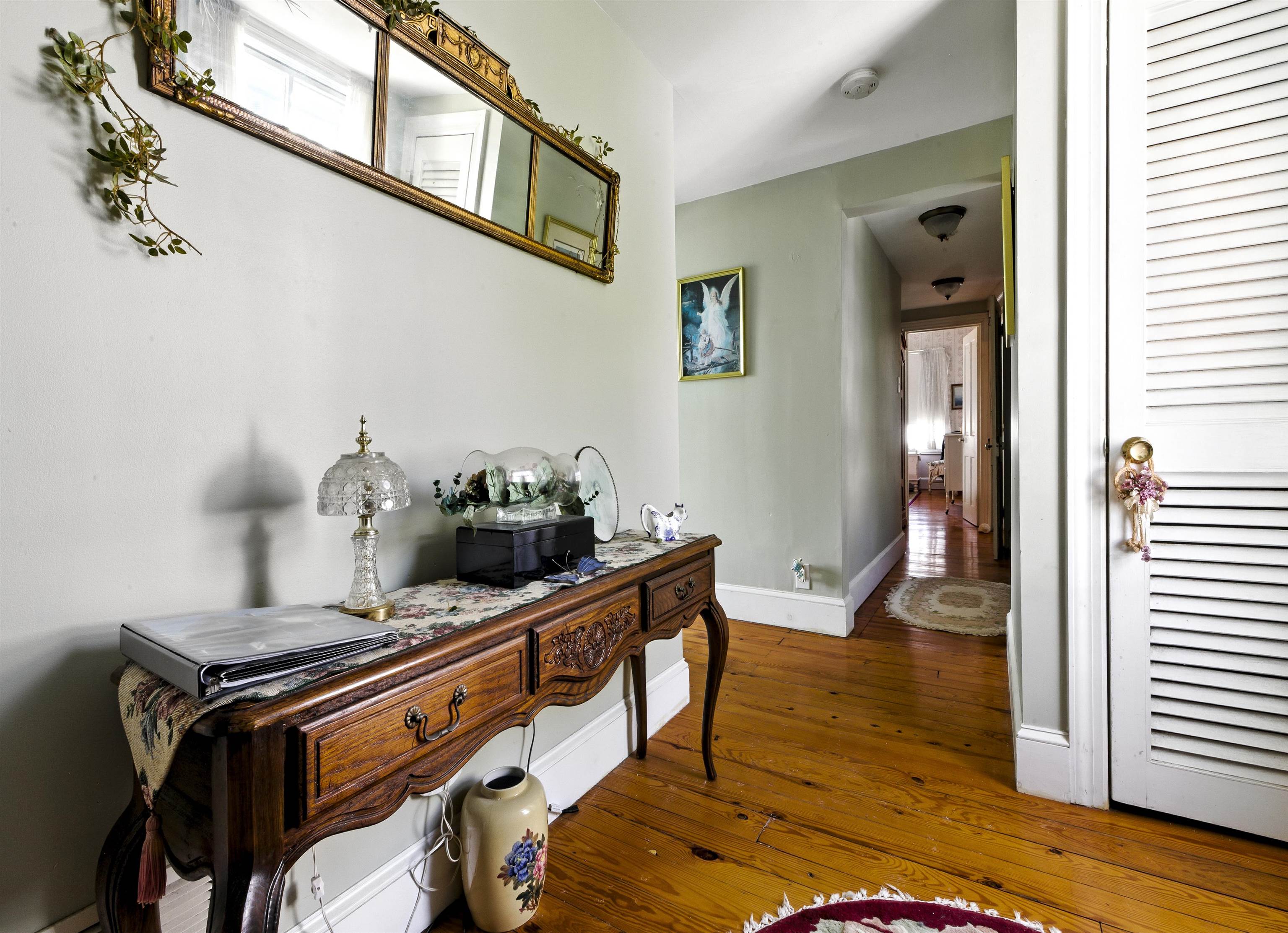 35 1st Cape May, NJ 08204 - Photo 23 of 49 a hallway with mirror and furniture