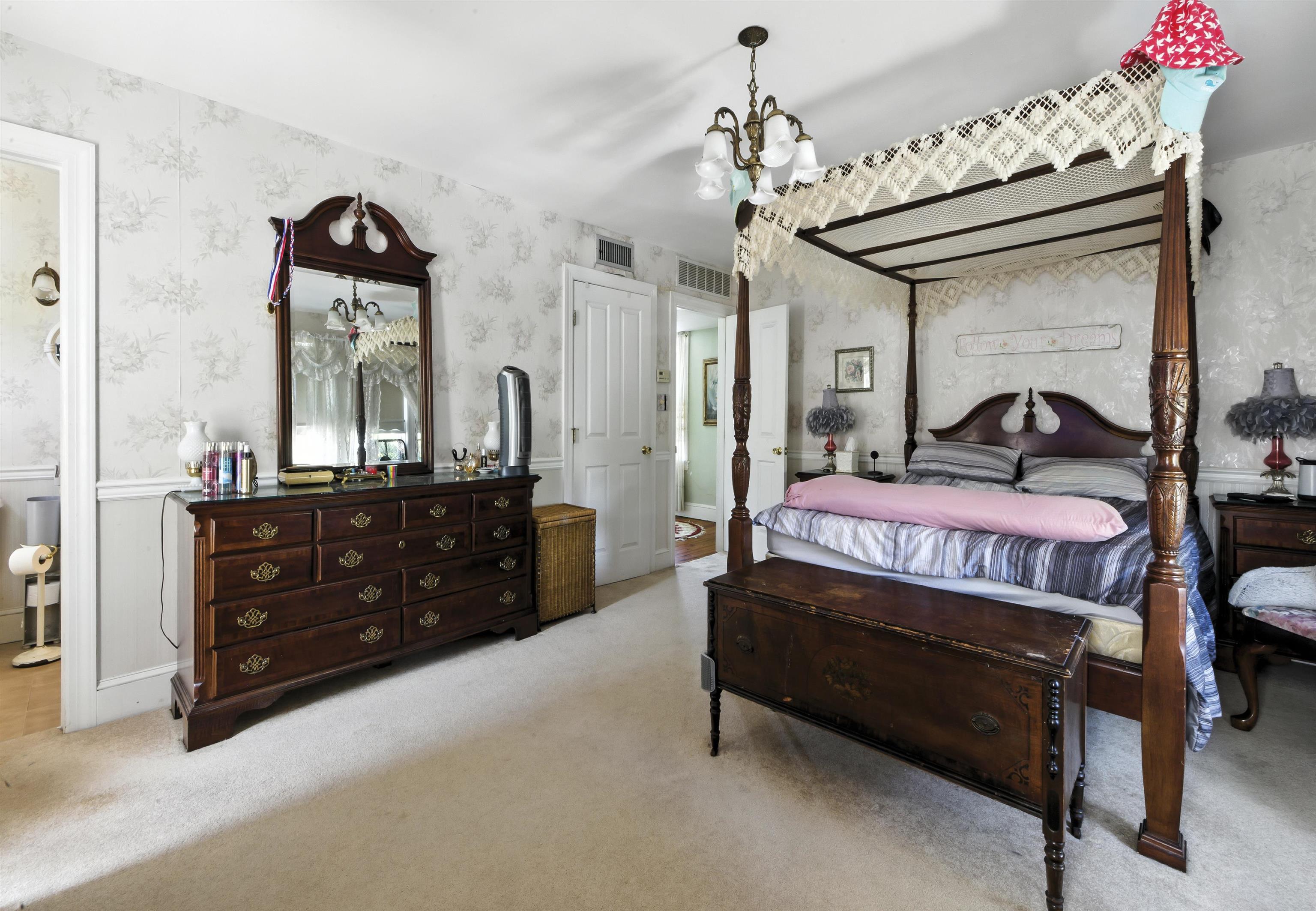 35 1st Cape May, NJ 08204 - Photo 24 of 49 a bedroom with a bed a dresser and mirror
