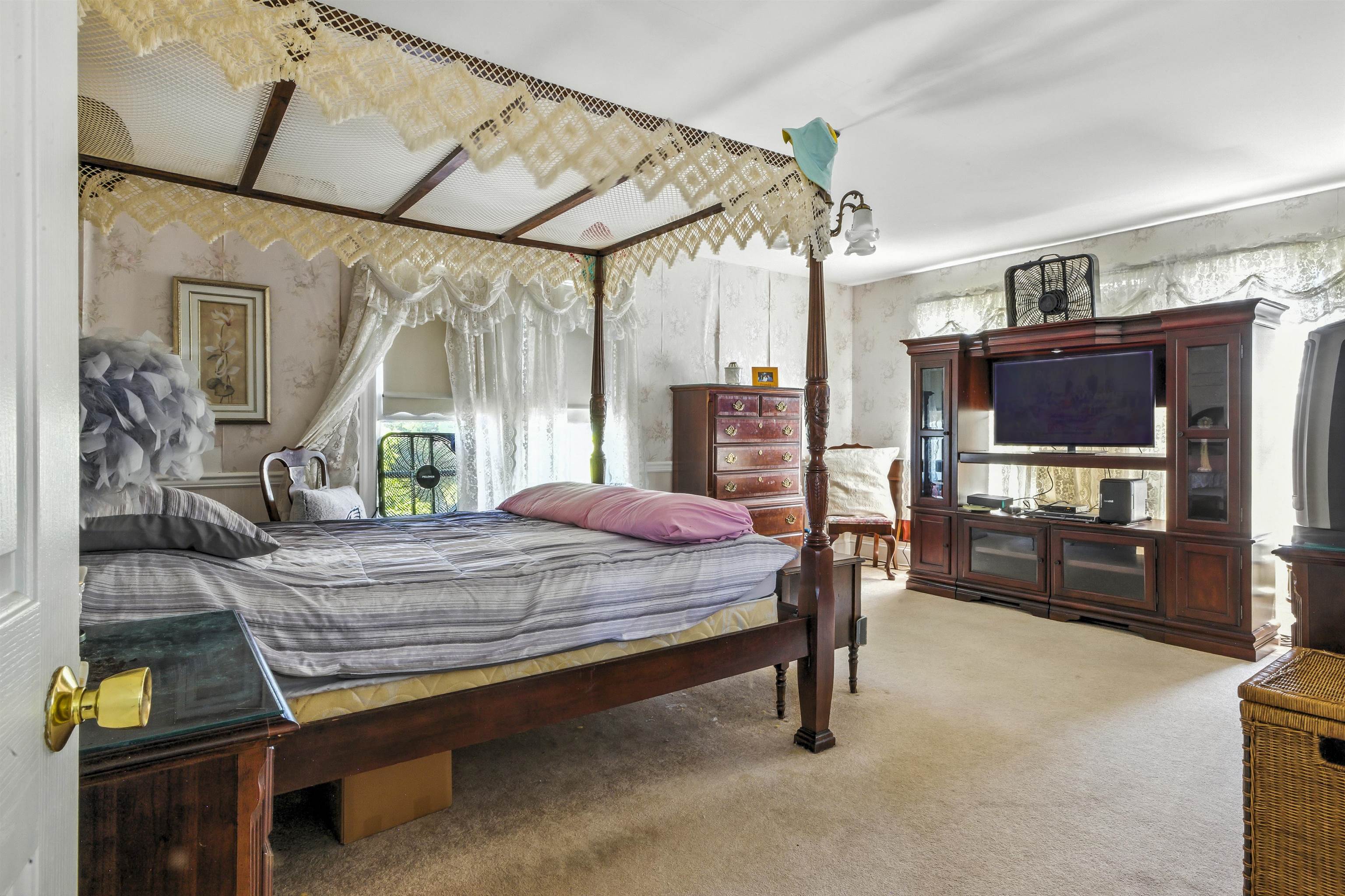 35 1st Cape May, NJ 08204 - Photo 25 of 49 a bedroom with a bed dresser and a flat tv screen