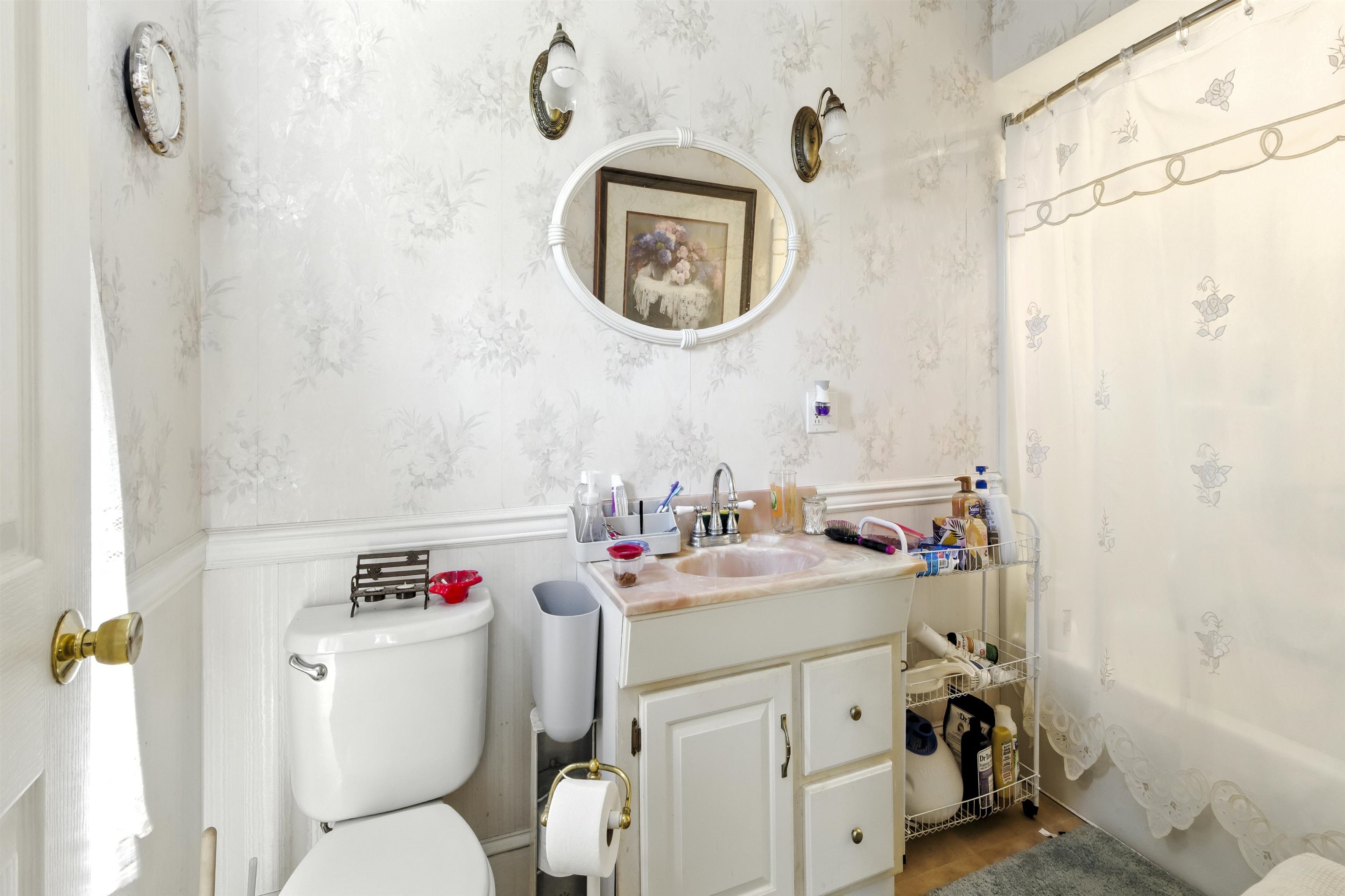 35 1st Cape May, NJ 08204 - Photo 26 of 49 a bathroom with a sink mirror vanity and toilet
