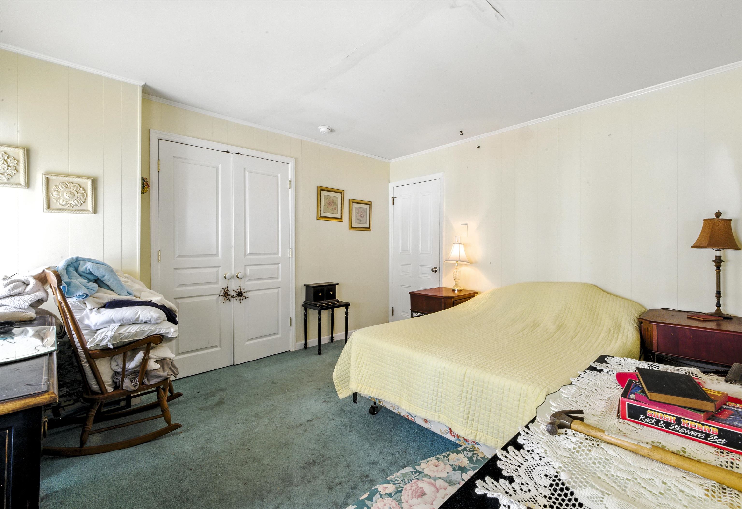 35 1st Cape May, NJ 08204 - Photo 27 of 49 a bedroom with a bed and a chair