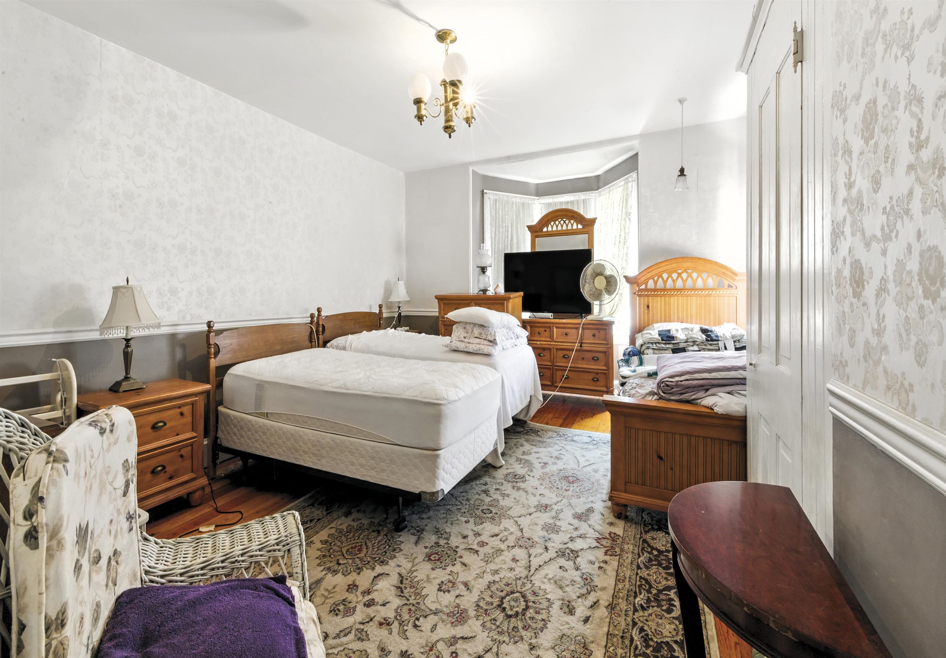 35 1st Cape May, NJ 08204 - Photo 29 of 49 a bedroom with a bed and a chandelier