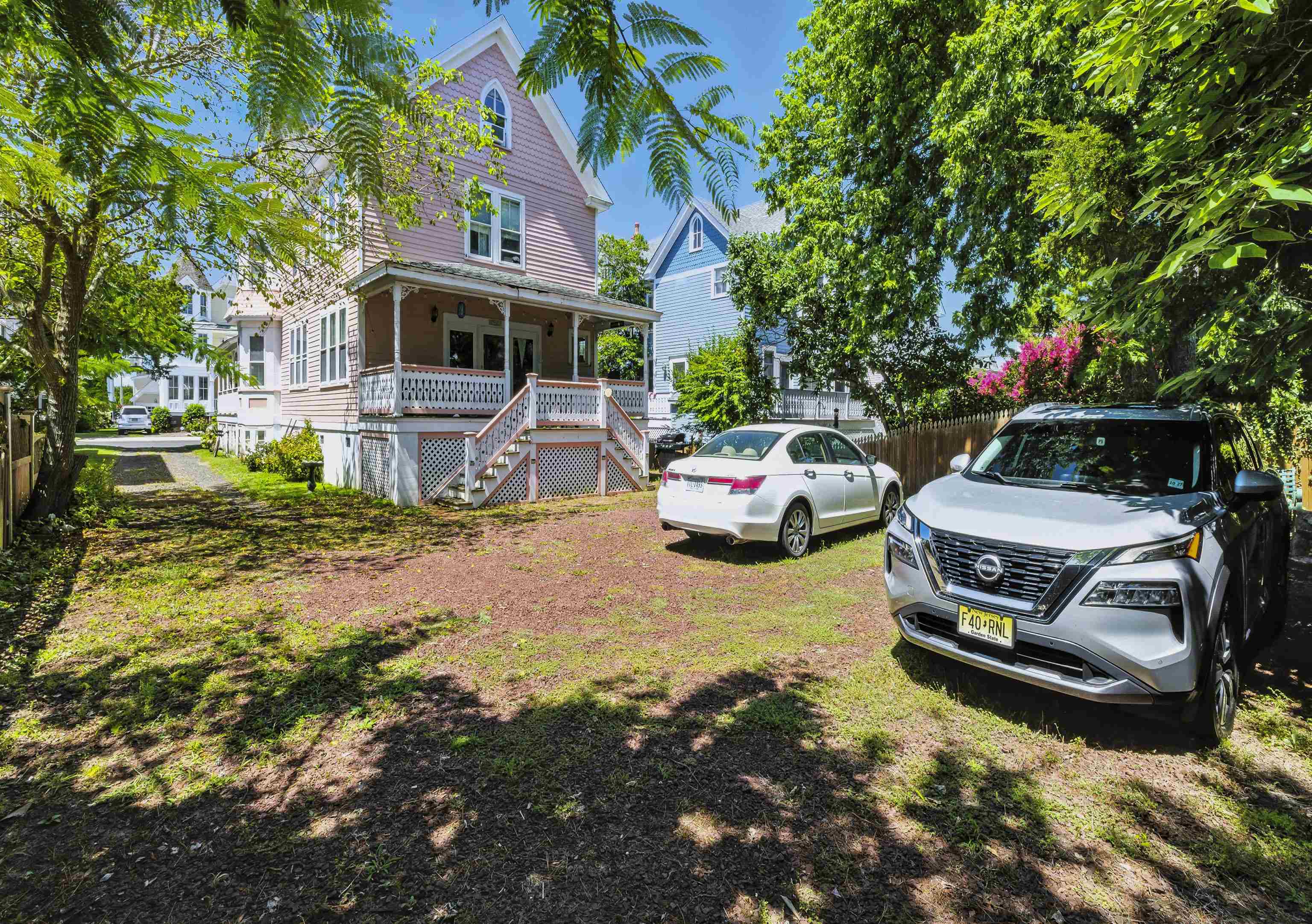 35 1st Cape May, NJ 08204 - Photo 5 of 49 a front view of a house with a garden and swimming pool