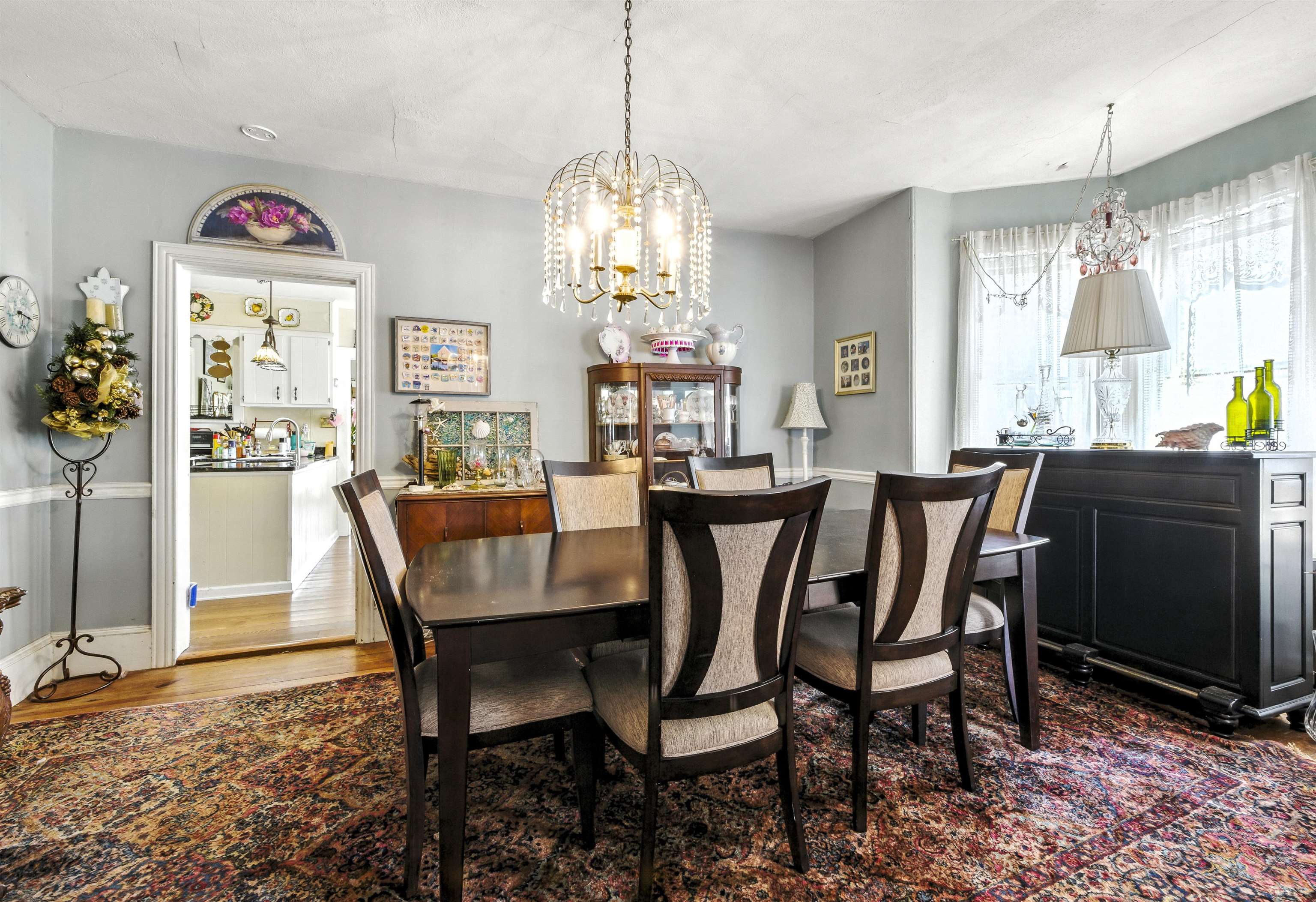 35 1st Cape May, NJ 08204 - Photo 7 of 49 a dining room with furniture a chandelier and window