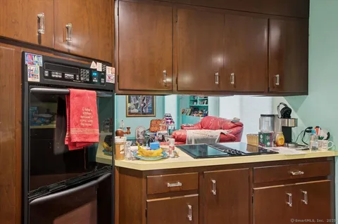 a kitchen with a sink cabinets and appliances