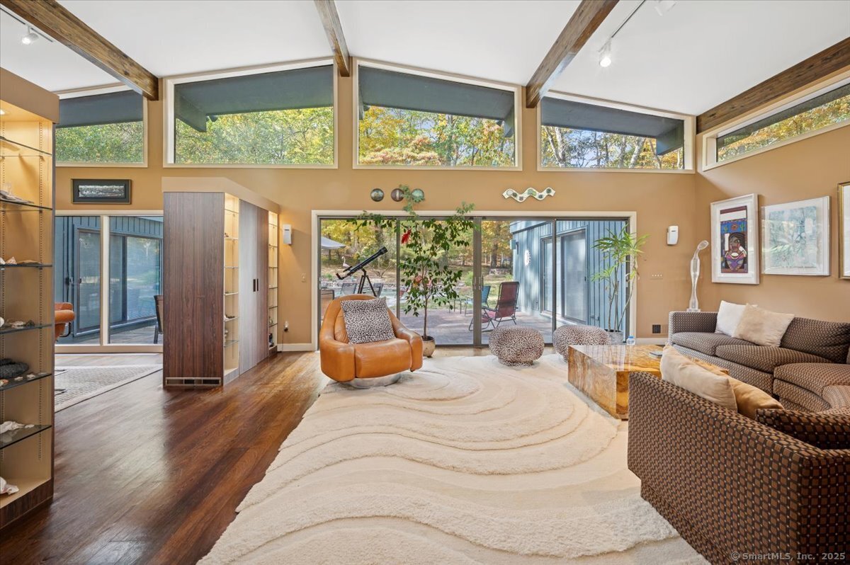 100 East Common Road Easton, CT 06612 - Photo 5 of 25 a bedroom with furniture and large windows