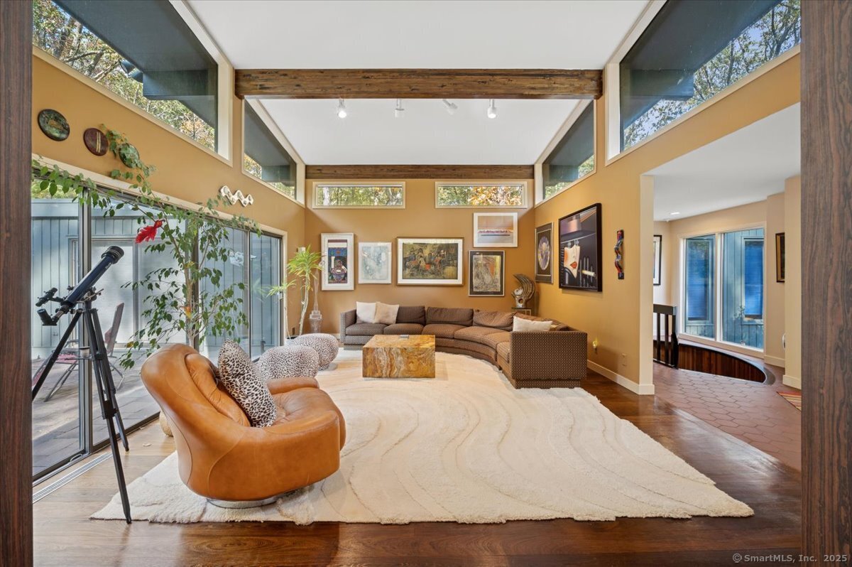 100 East Common Road Easton, CT 06612 - Photo 8 of 25 a bedroom with furniture and a large window