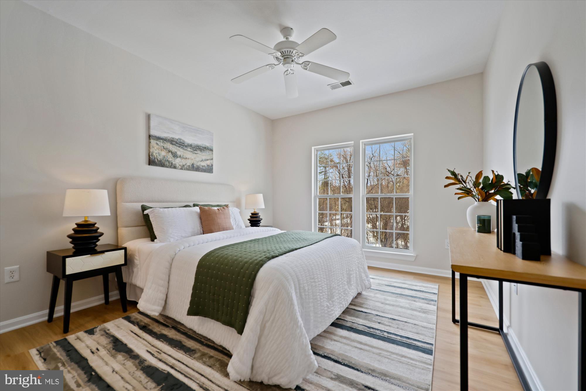 106 Booth Street, Unit 34 Gaithersburg, MD 20878 - Photo 15 of 46 a bed room with a bed and a chandelier