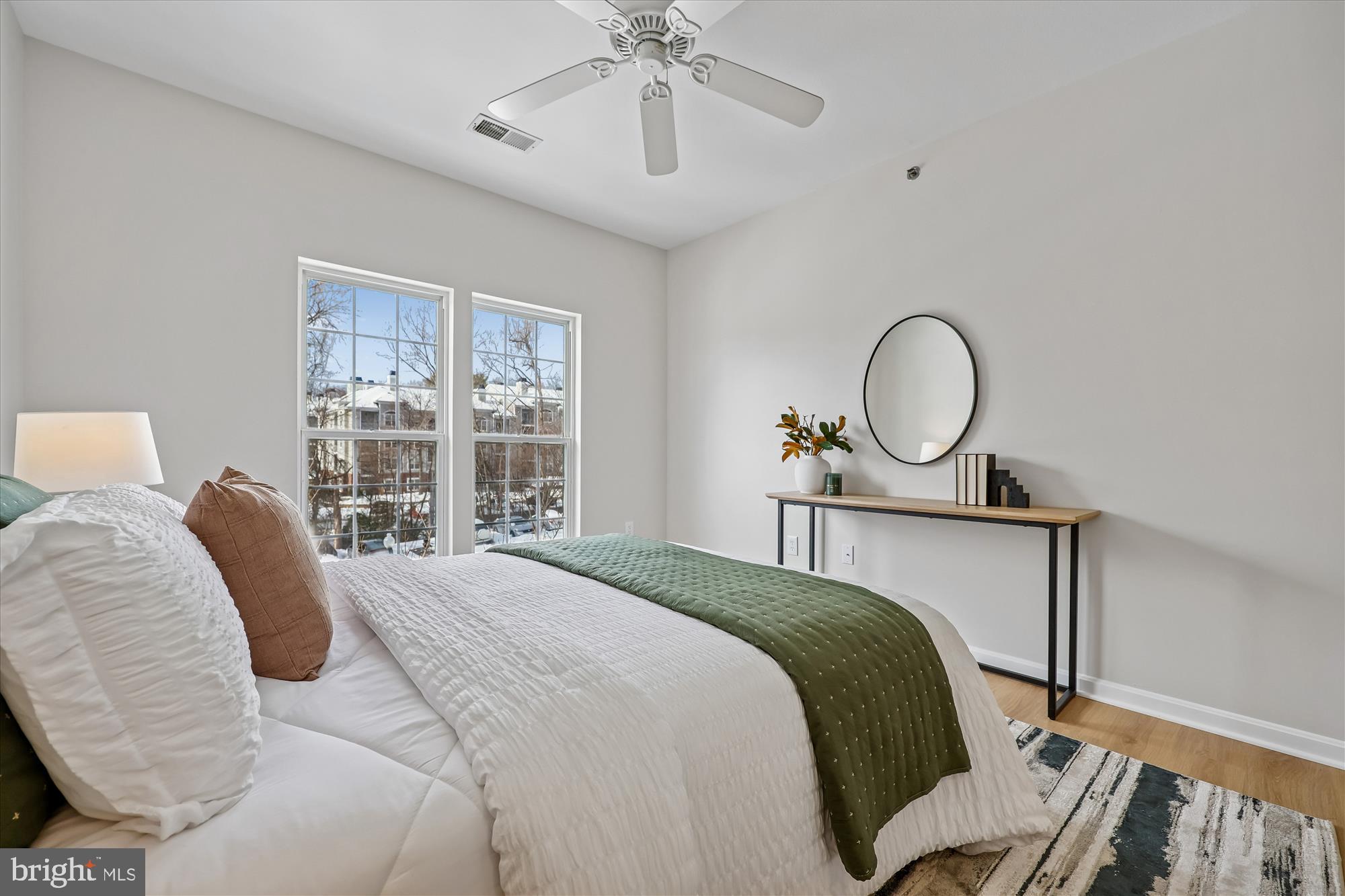 106 Booth Street, Unit 34 Gaithersburg, MD 20878 - Photo 16 of 46 a bedroom with a bed large window with wooden floor