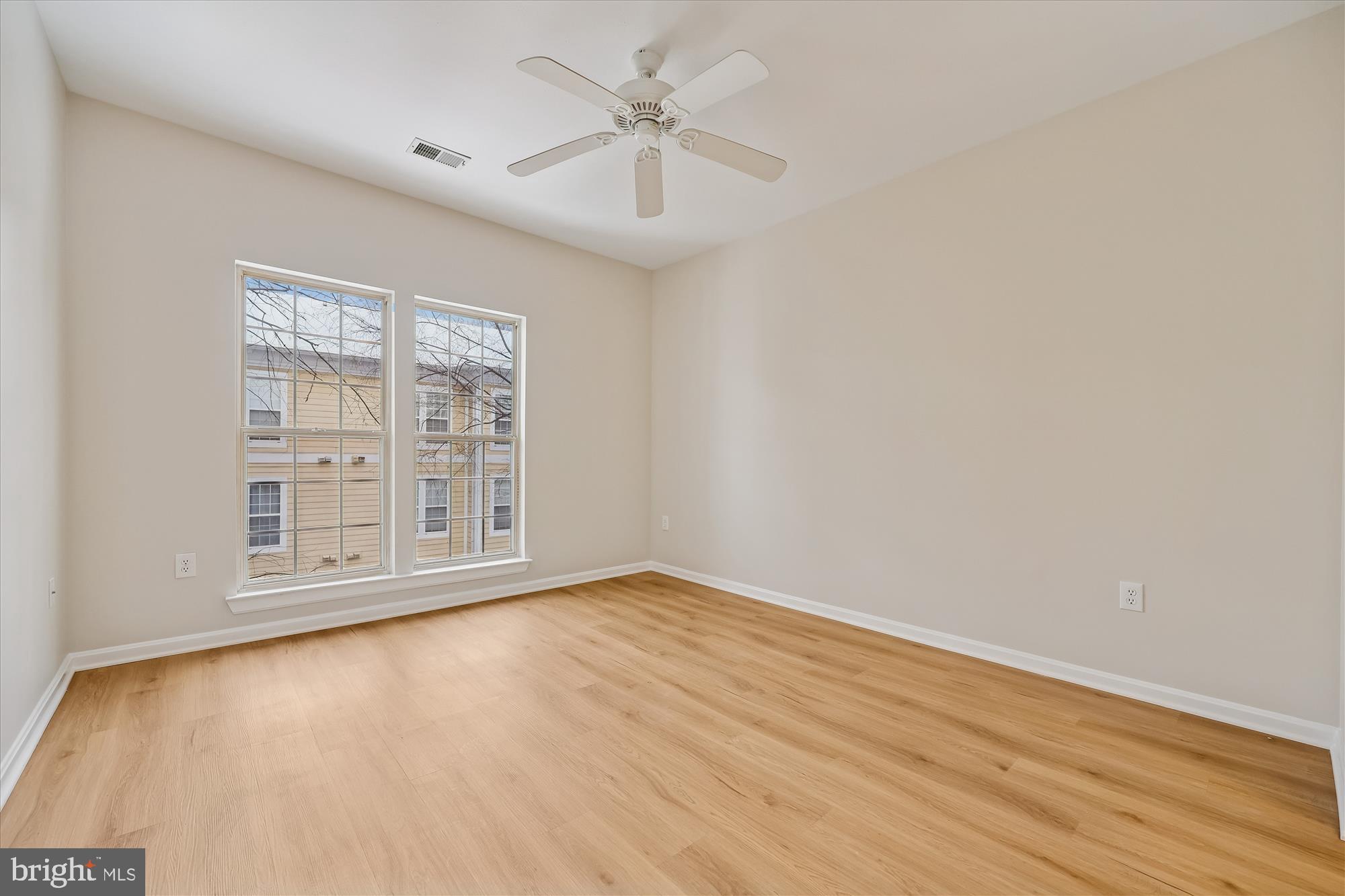 106 Booth Street, Unit 34 Gaithersburg, MD 20878 - Photo 19 of 46 wooden floor in an empty room with a window