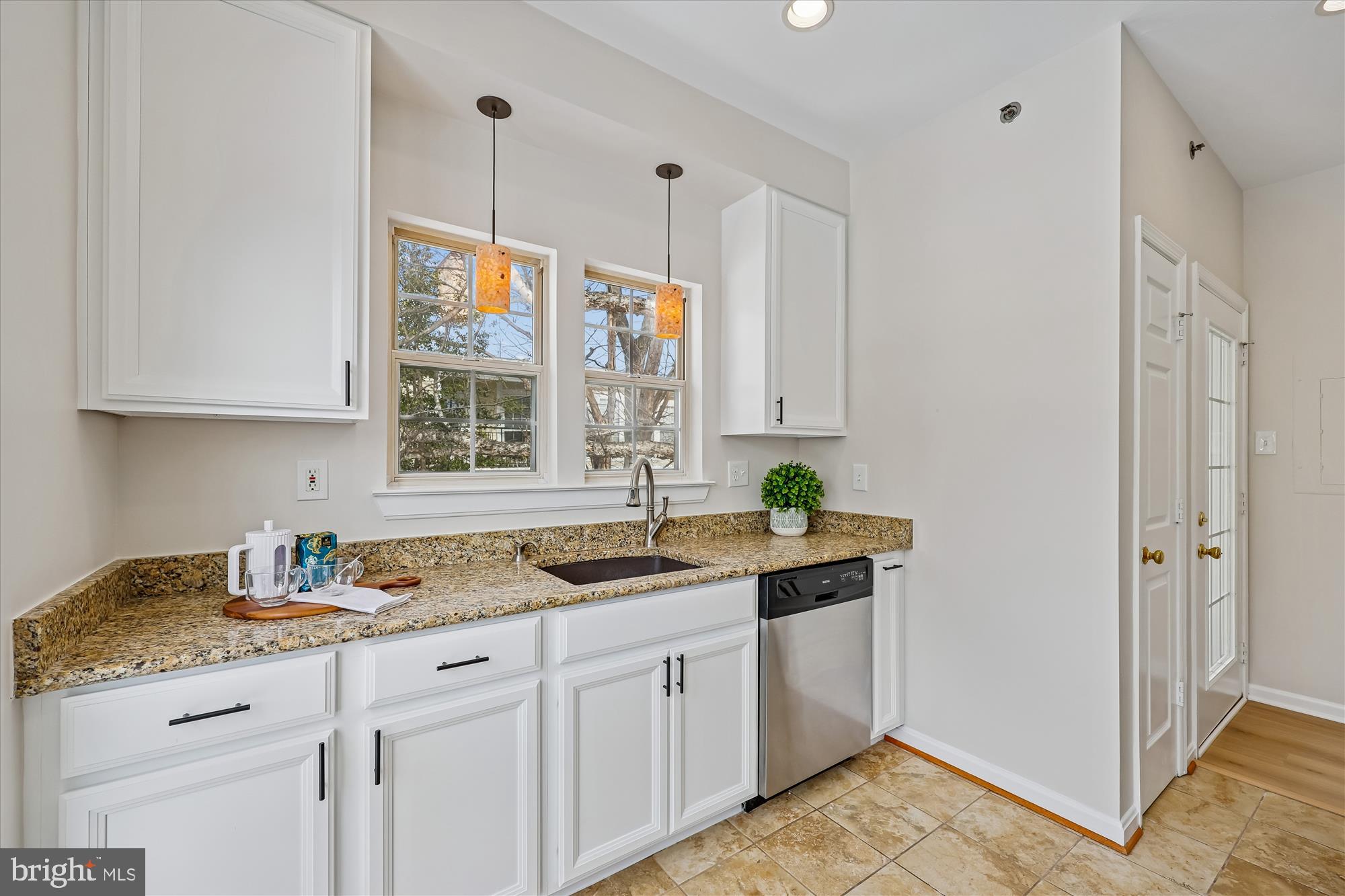106 Booth Street, Unit 34 Gaithersburg, MD 20878 - Photo 8 of 46 a kitchen with a sink and cabinets