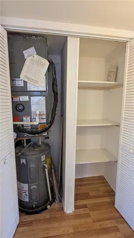 a view of storage and utility room in wooden floor