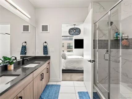 a kitchen with a refrigerator and a sink