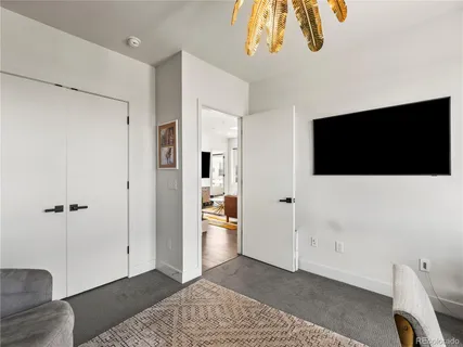a view of a livingroom with a flat screen tv