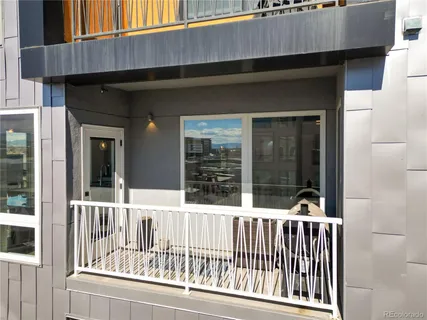 a view of a chair and table in the balcony