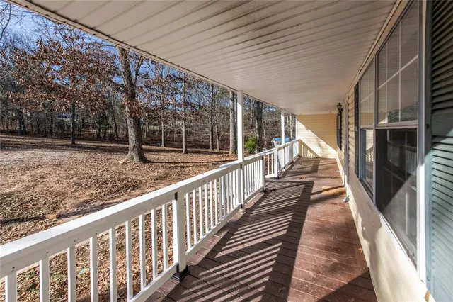 a view of balcony with wooden floor