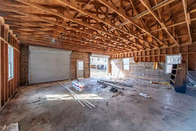 a view of a room with wooden walls