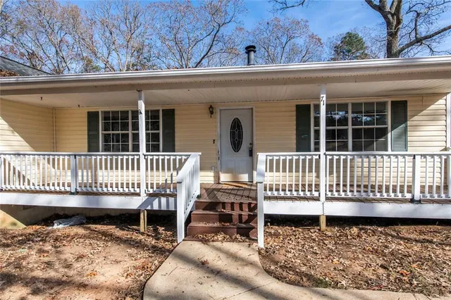 front view of a house with a bench