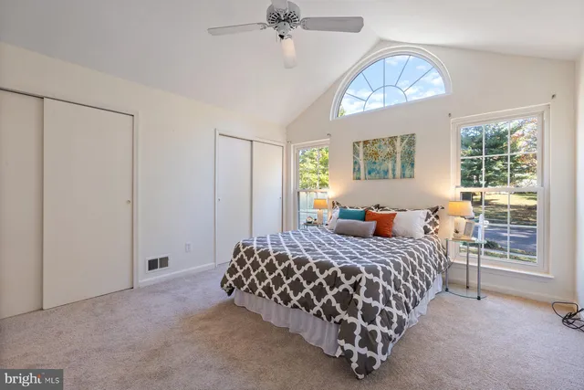 a view of a house with wooden deck