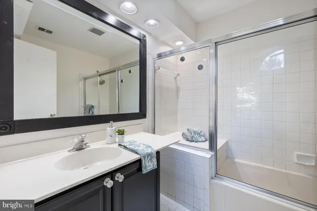 a view of backyard with deck and outdoor seating