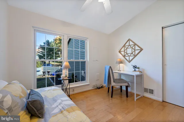 a bathroom with a sink double vanity mirror and a bathtub