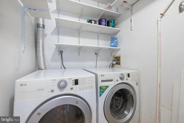 a view of a livingroom with furniture and a window