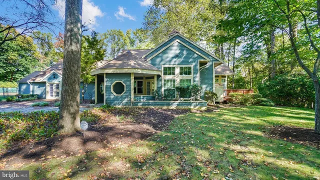 a view of yard with green space and seating area